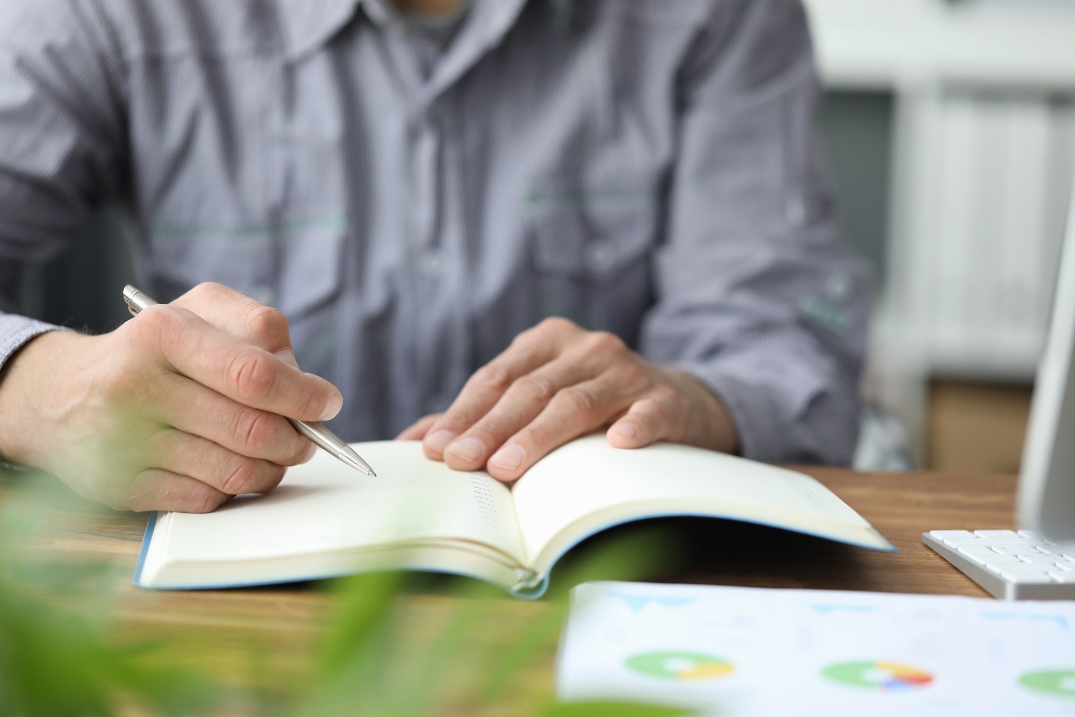 Person writing in notebook
